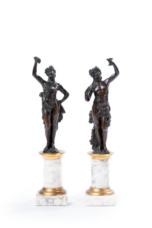 219 - <p><span class="object_title">Pareja de bacantes en bronce pavonado sobre columna símil mármol y base escanolanda en madera tallada. <br/></span><br></p>