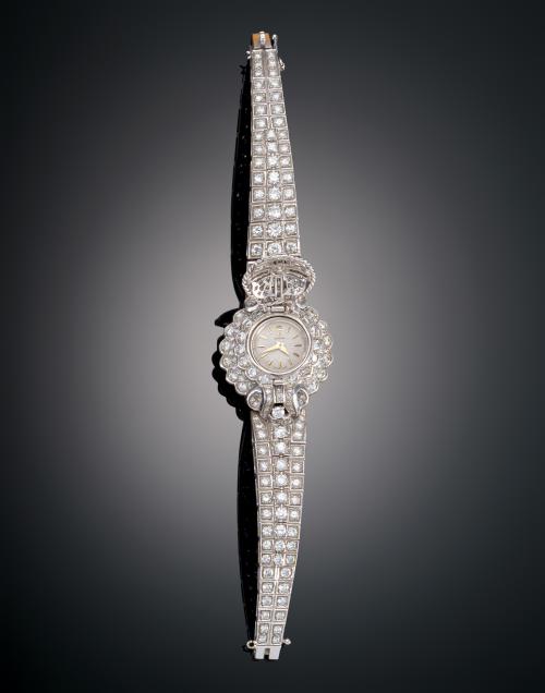 1086   -  <p><span class="object_title">PULSERA "RETRO" DE DIAMANTES CON MAQUINARIA OMEGA</span></p>