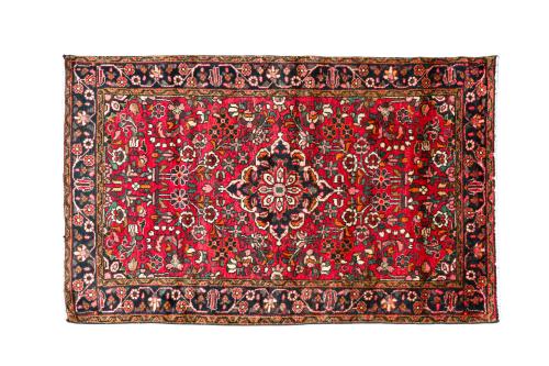 309   -  <p><span class="object_title">Alfombra persa en lana con motivo romboidal central y motivos vegetales y florales sobre campo rojo.</span><br></p>