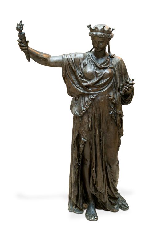 Escultura en bronce pavonado representando La Estatua de la