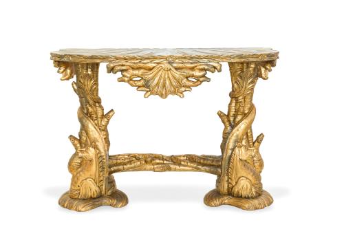 238   -  <p><span class="object_title">Consola antigua en madera tallada y dorada, faldón con venera, patas con ramas y motivos vegetales. </span><br></p>