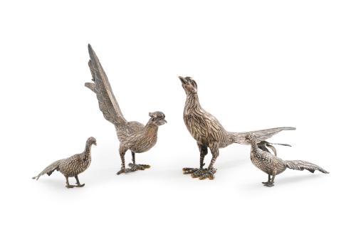 Lote formado por dos parejas de faisanes en plata. 