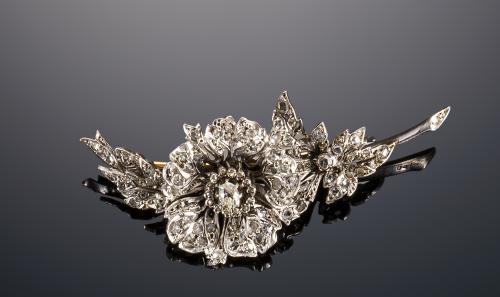 627   -  <p><span class="object_title">BROCHE FLOR CON SOLITARIO CENTRAL</span></p>
