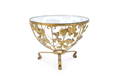 Mesa de centro circular en metal dorado con original decora