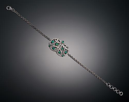 PULSERA DOBLE CÍRCULO CON DIAMANTES Y ESMERALDAS EN ORO BLA