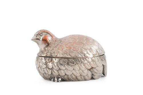 Pájaro en metal plateado 