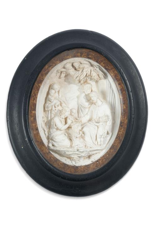 Bajorrelieve de forma ovalada en piedra con escena de Crist